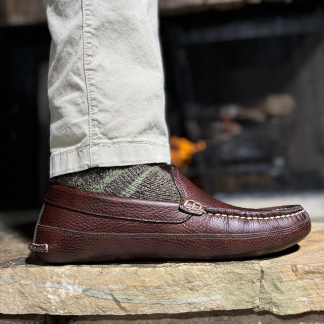 Man wearing Mike's dark brown leather moccasins