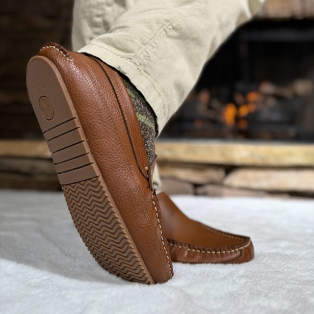 Side view of Sam's brown leather moccasin