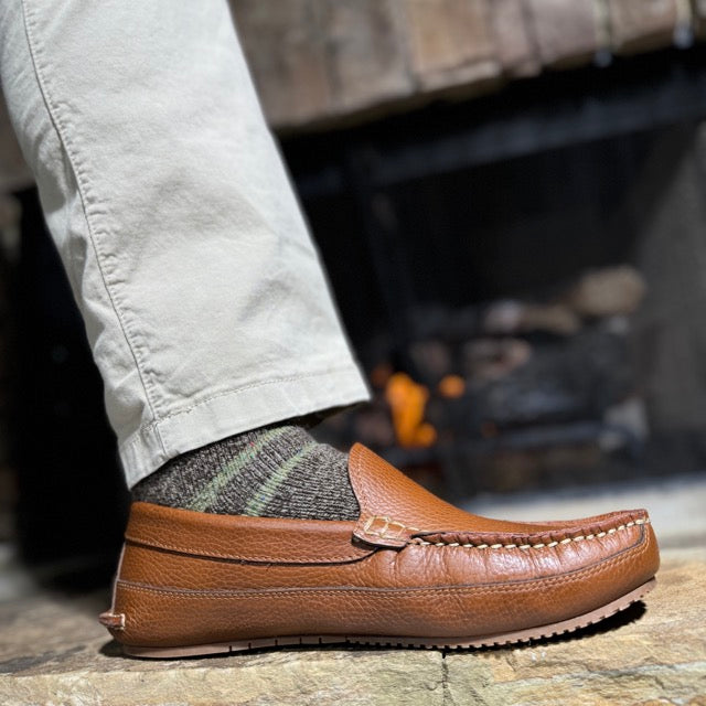 Man wearing Shane's light brown leather moccasins