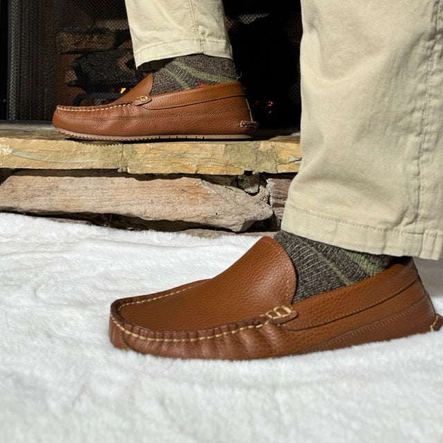 Side view of Shane's light brown leather moccasin