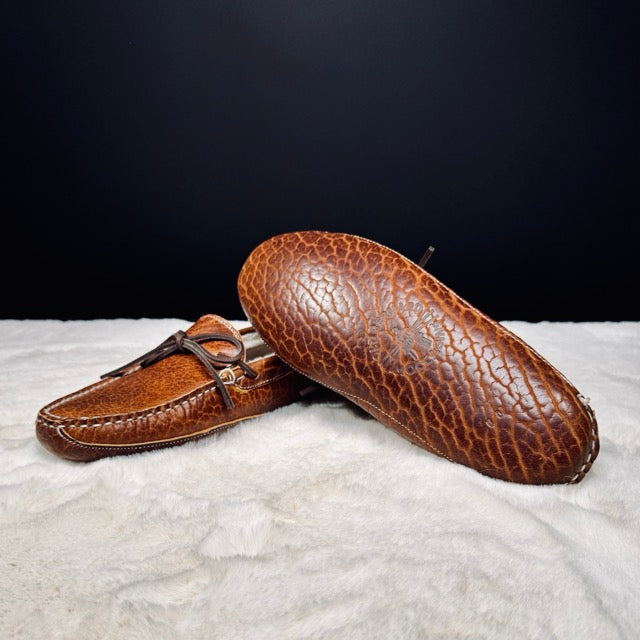 Top view of Winston's moccasin showing laces and white stitching